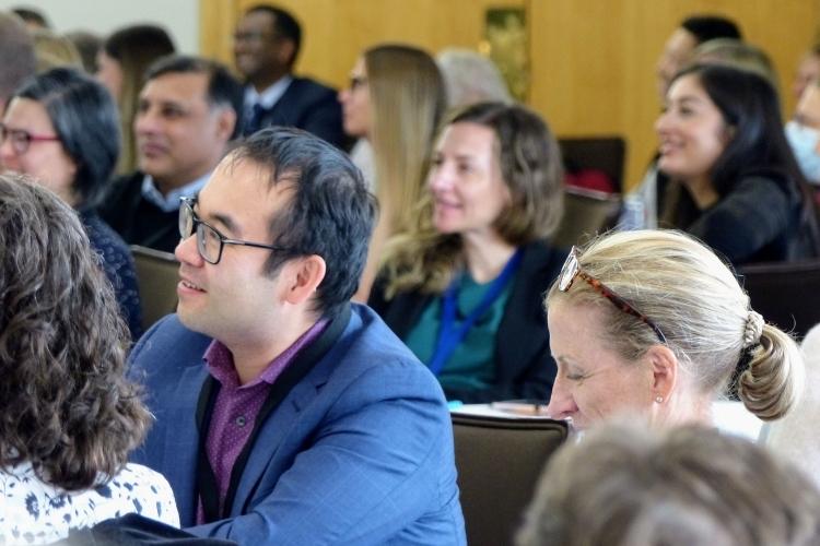 man in audience sitting attentively and listening at SQI congress